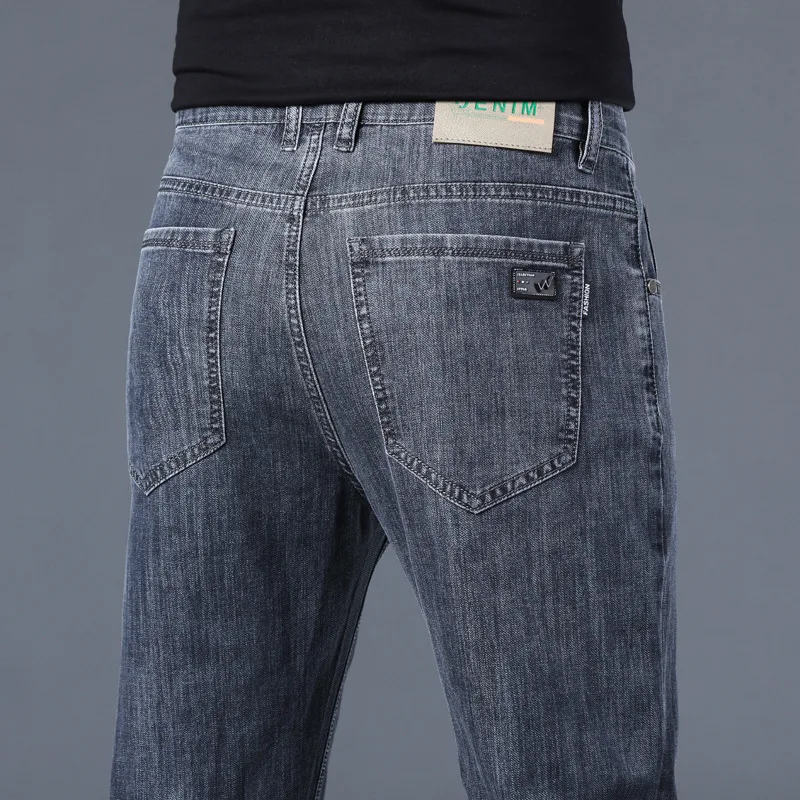 Летние тонкие джинсы из ледяного шелка 2023 года, мужские прямые облегающие стрейчевые повседневные брюки, Модные брюки для мальчиков Оптом